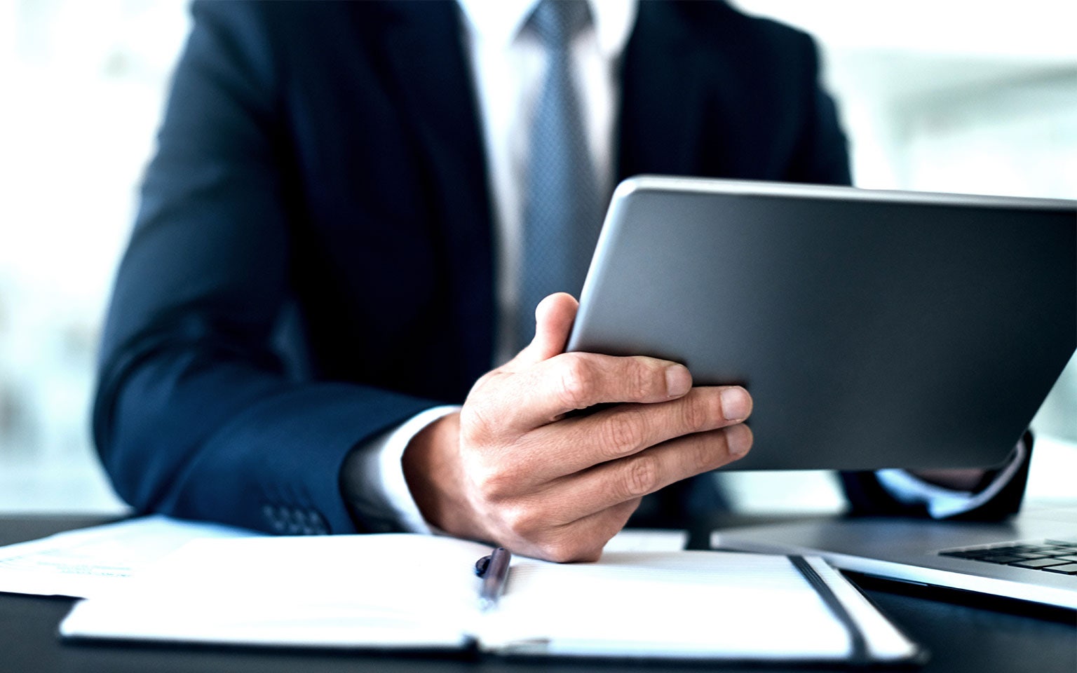 businessman holding tablet