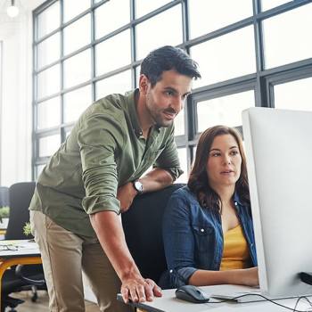 Kyocera Group colleagues working in an open plan office