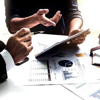 close up of man pointing at tablet