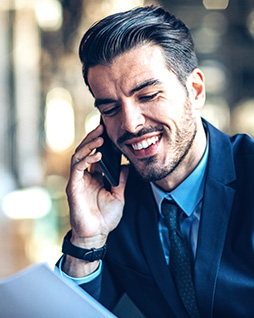 two men working with a tablet